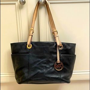 MK black leather purse.